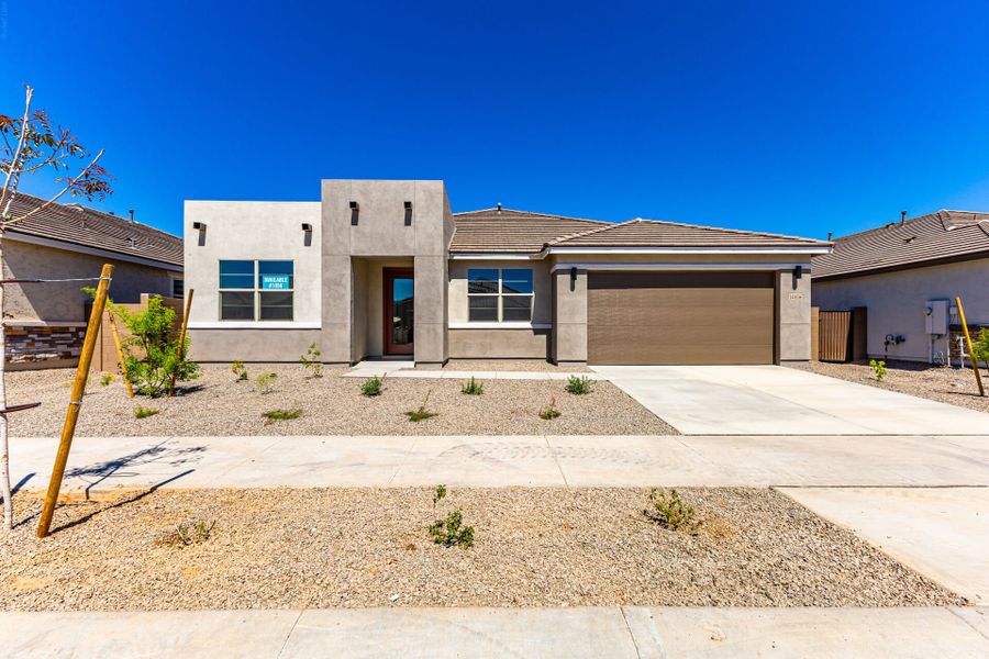 Front exterior of a new home in Miravida, Surprise, AZ, highlighting curb appeal (Image 1). Front exterior of a new home in Miravida, Surprise, AZ, highlighting curb appeal (Image 1).