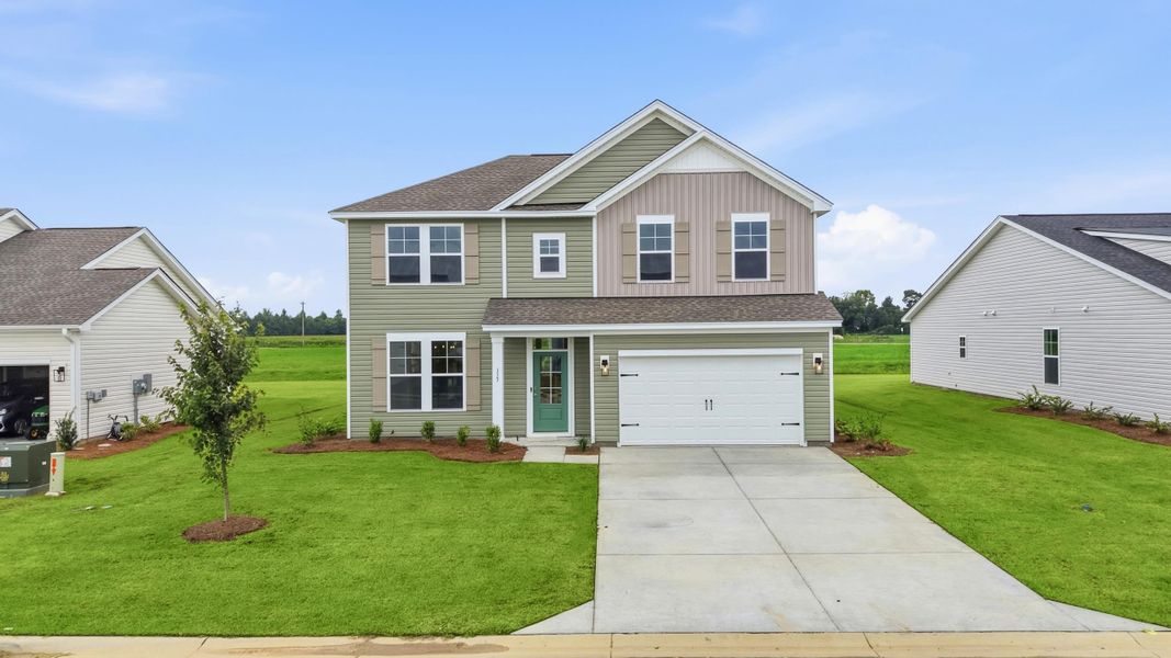 Front exterior of a new home in Edgefield, Loris, SC, highlighting curb appeal (Image 25). Front exterior of a new home in Edgefield, Loris, SC, highlighting curb appeal (Image 25).