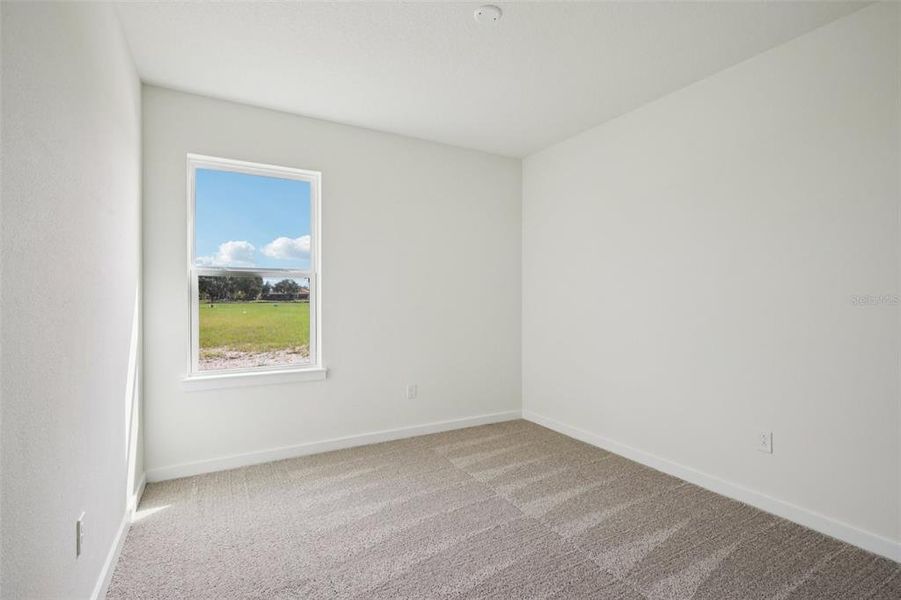 Spacious, unfurnished interior of a new home in Grasslands West, Lakeland (Image 14).