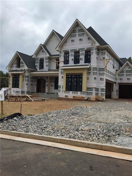 Front exterior of a new home in , Cumming, GA, highlighting curb appeal (Image 2). Front exterior of a new home in , Cumming, GA, highlighting curb appeal (Image 2).