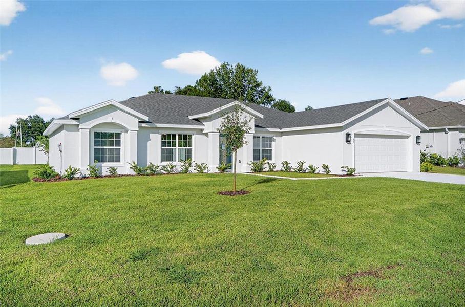 Front exterior of a new home in , Palm Coast, FL, highlighting curb appeal (Image 22).