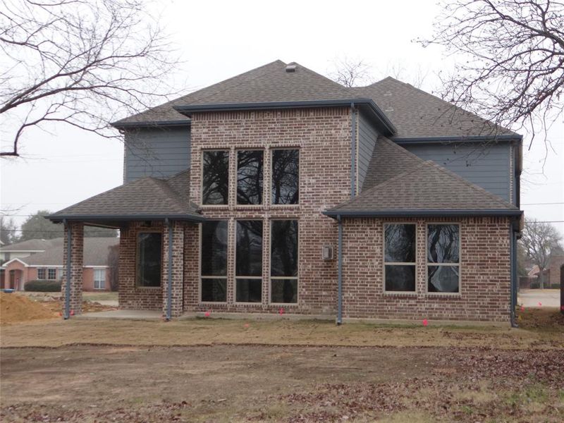 Rear view of property with a patio area