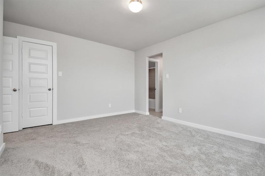 Generously sized secondary bedrooms, complete with spacious closets and soft, inviting carpeting. Enjoy abundant natural light streaming in through the large windows. Sample photo of completed home with similar floor plan. Actual colors and selections may vary.