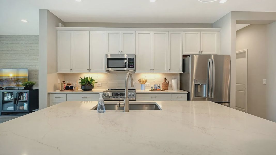 Representative furnished interior of a home built from the Avery by Neal Communities in SkySail, Naples (Image 25).