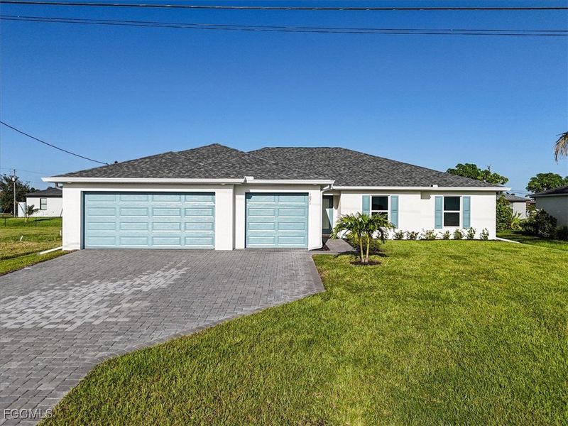 Front exterior of a new home in Cape Coral, Cape Coral, FL, highlighting curb appeal (Image 20).