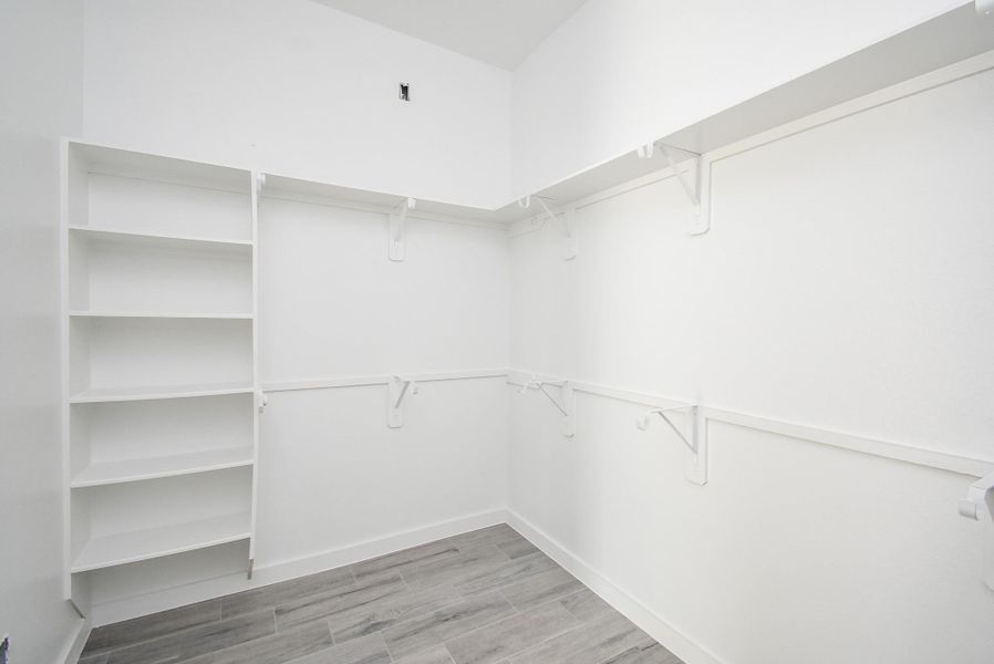 Primary Bedroom Closet with built-in shelves!