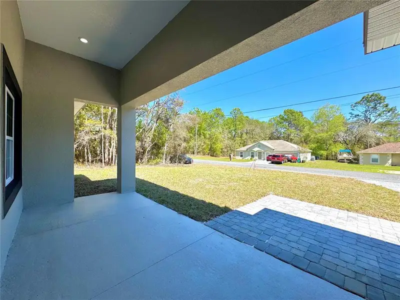 Exterior details and patio area of a home in , Citrus Springs (Image 3).