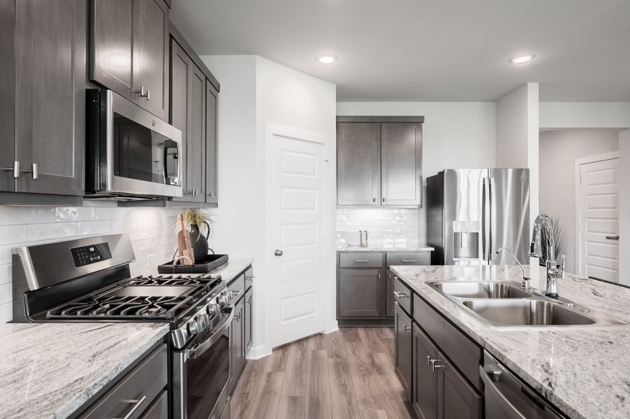 Representative furnished interior of a home built from the Yellowstar by Tri Pointe Homes in Mason Woods, Cypress (Image 5).