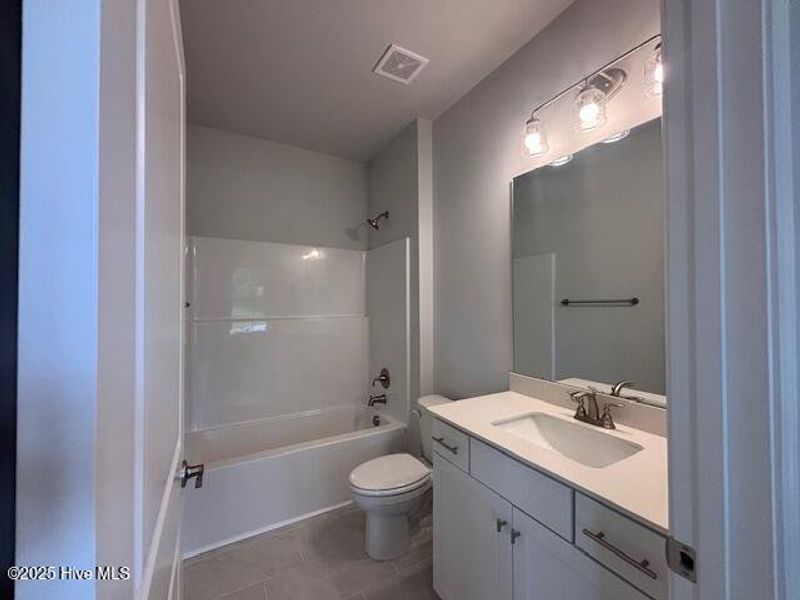 Furnished interior view inside a new home in River Village Square in River Landing, Wallace (Image 4).