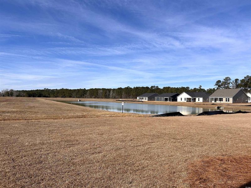 Water view featuring nearby suburban area