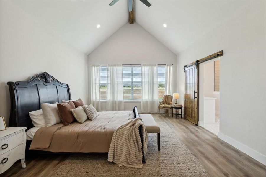 Vaulted ceiling with exposed beam and ceiling fan