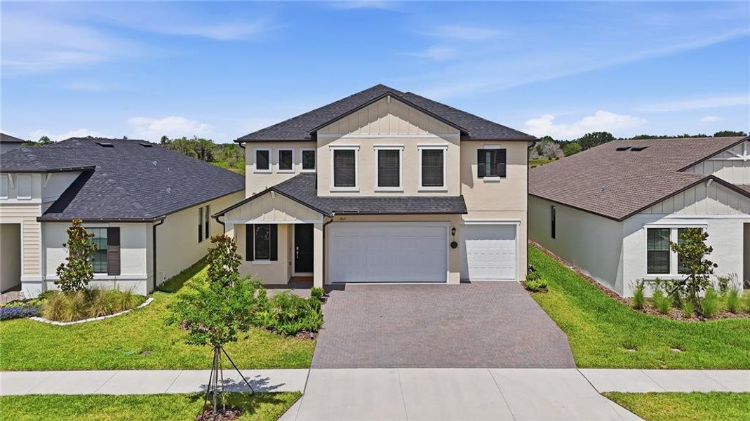 Front exterior of a new home in Connerton, Land O' Lakes, FL, highlighting curb appeal (Image 29).