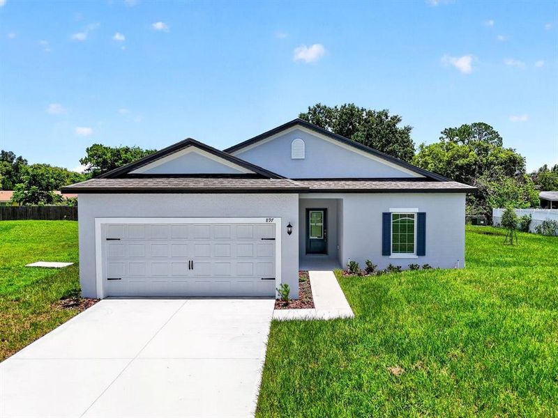 Front exterior of a new home in , Deltona, FL, highlighting curb appeal (Image 22). Front exterior of a new home in , Deltona, FL, highlighting curb appeal (Image 22).