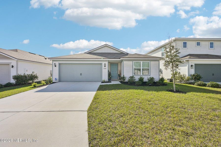 Front exterior of a new home in , Jacksonville, FL, highlighting curb appeal (Image 26).