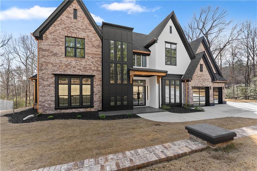 Front exterior of a new home in , Loganville, GA, highlighting curb appeal (Image 31). Front exterior of a new home in , Loganville, GA, highlighting curb appeal (Image 31).