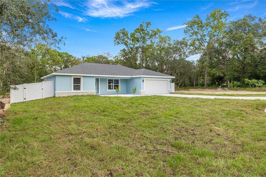 Front exterior of a new home in , Ocklawaha, FL, highlighting curb appeal (Image 19). Front exterior of a new home in , Ocklawaha, FL, highlighting curb appeal (Image 19).