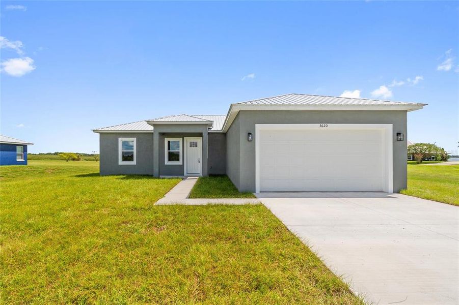 Front exterior of a new home in , Fort Meade, FL, highlighting curb appeal (Image 20).