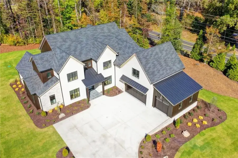 Front exterior of a new home in Lyndon Creek, Milton, GA, highlighting curb appeal (Image 40).