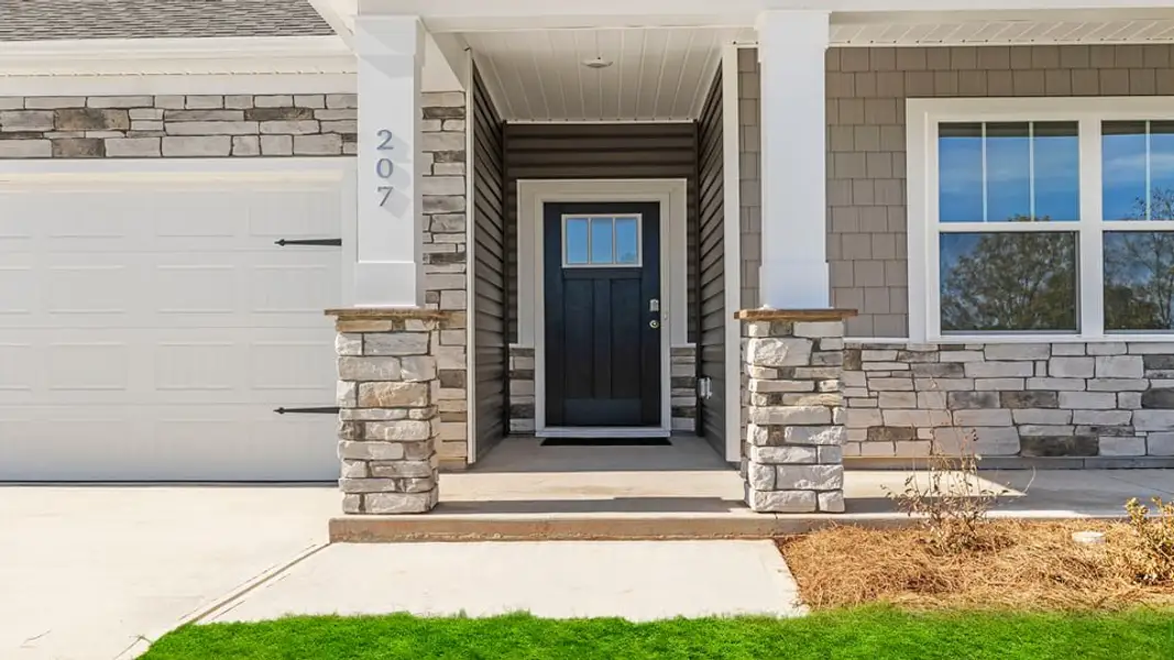 Exterior details and patio area of a home in Sherwood Gardens, Landrum (Image 3).
