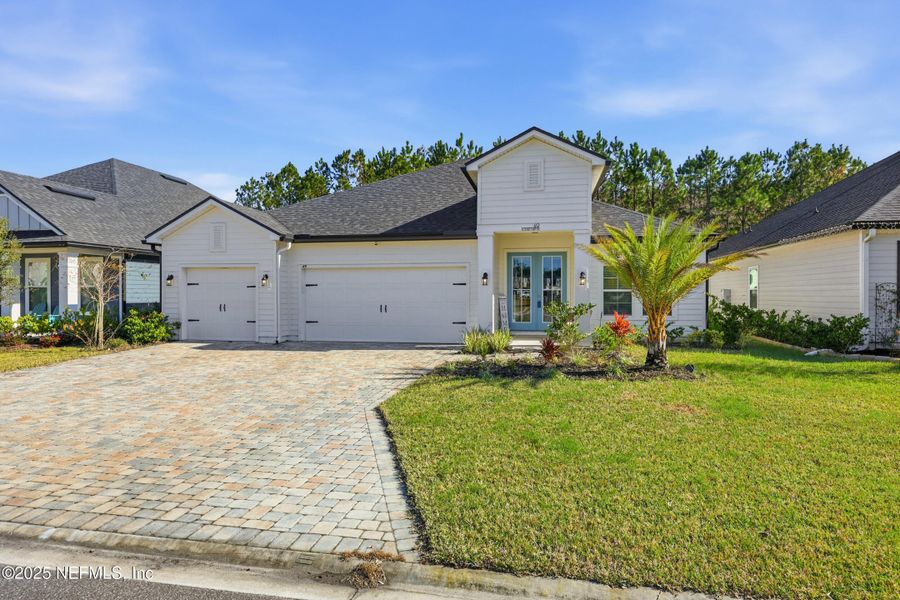 Front exterior of a new home in Silver Landing at SilverLeaf, St. Augustine, FL, highlighting curb appeal (Image 24).