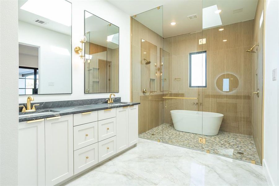 Bathroom with shower with separate bathtub, vanity, and plenty of natural light