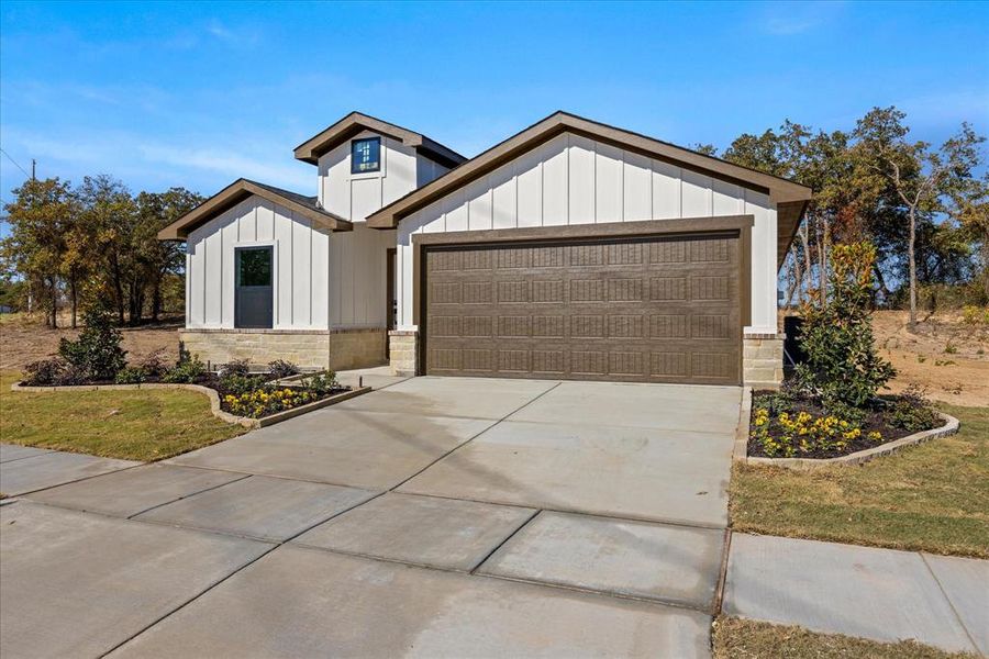 Front exterior of a new home in , Tolar, TX, highlighting curb appeal (Image 16). Front exterior of a new home in , Tolar, TX, highlighting curb appeal (Image 16).