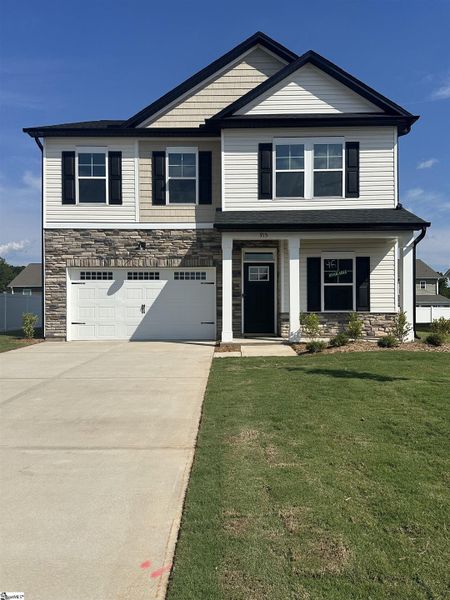 Front exterior of a new home in Shiloh Trail, Wellford, SC, highlighting curb appeal (Image 1).
