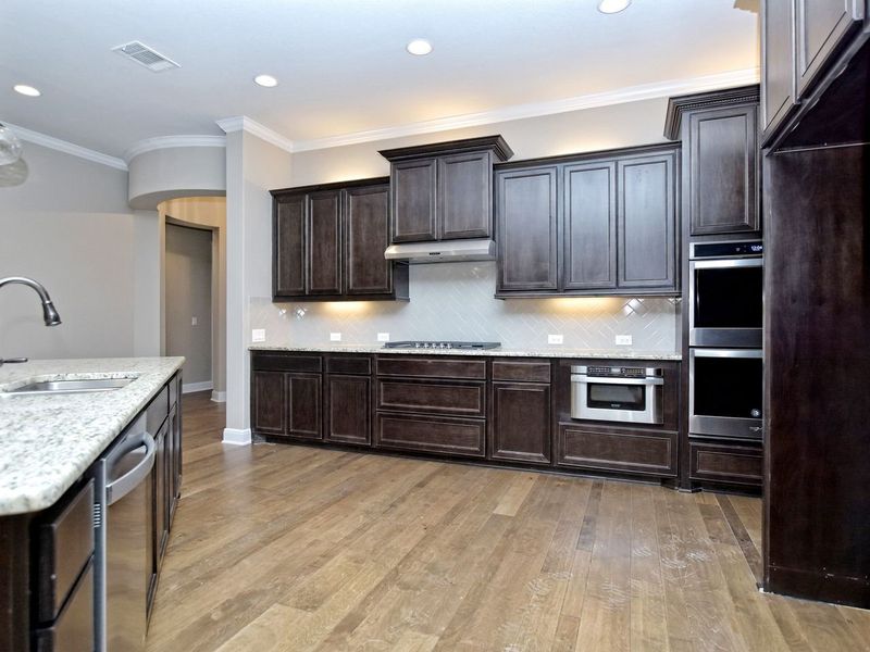 Representative furnished interior of a home built from the Madera II by Giddens Homes in Scofield Farms Estates, Georgetown (Image 262).