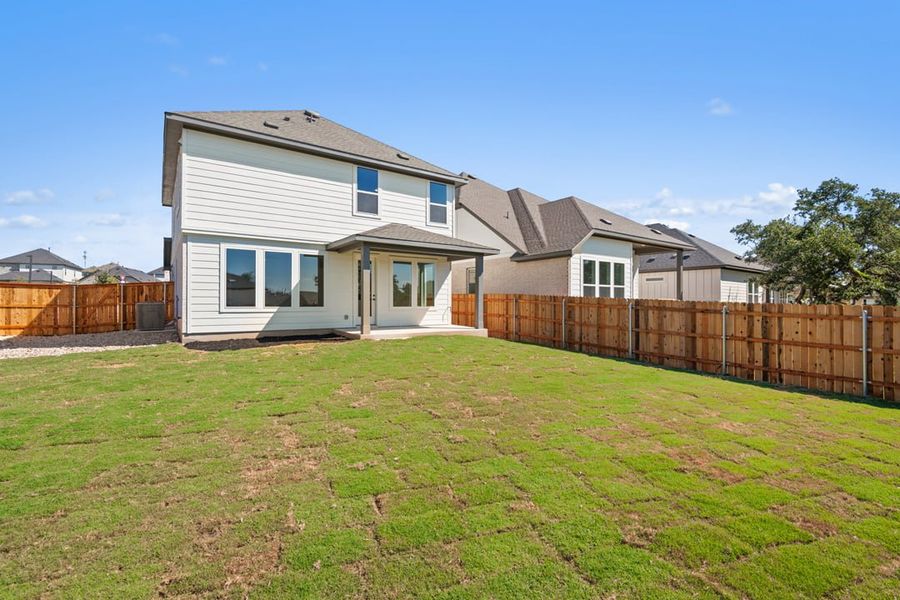 Exterior details and patio area of a home in Terrace Collection at Heritage, Dripping Springs (Image 26).
