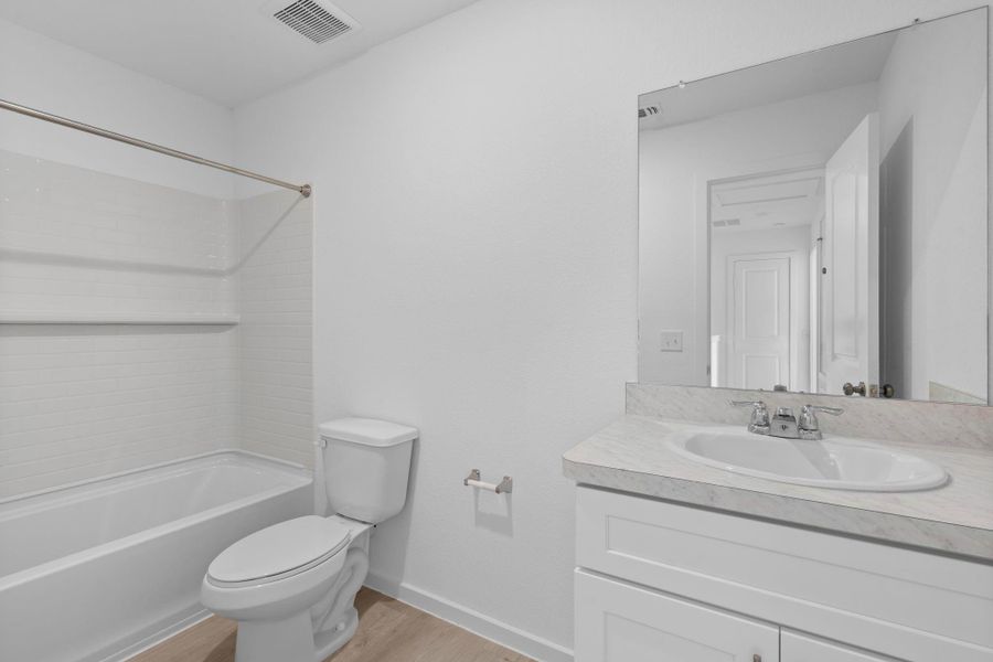 Furnished interior view inside a new home in The Courtyards at Stokesbury, Waller (Image 8).