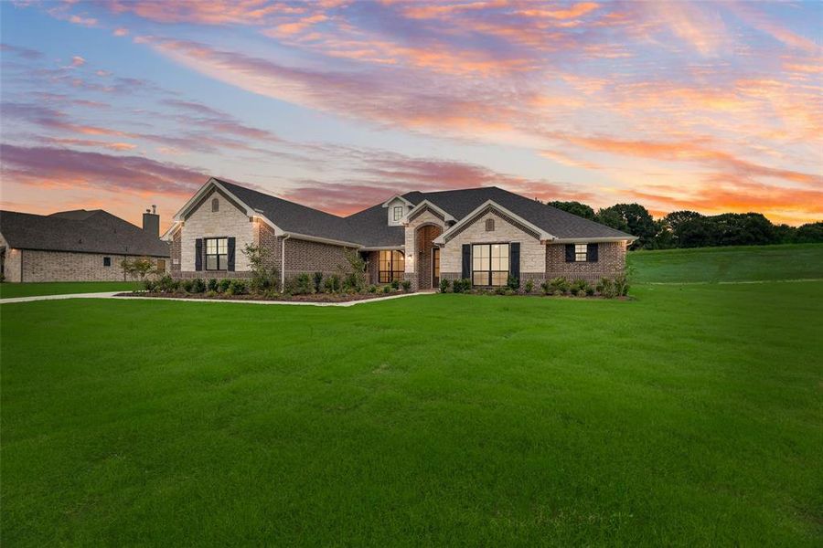 Front exterior of a new home in King Crossing Estates, Van Alstyne, TX, highlighting curb appeal (Image 18). Front exterior of a new home in King Crossing Estates, Van Alstyne, TX, highlighting curb appeal (Image 18).