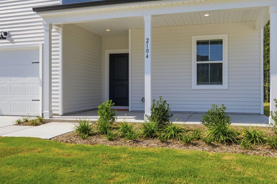 Exterior details and patio area of a home in Carpenter Falls, Durham (Image 30).