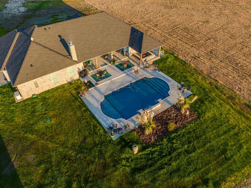 View of subject property featuring a pool