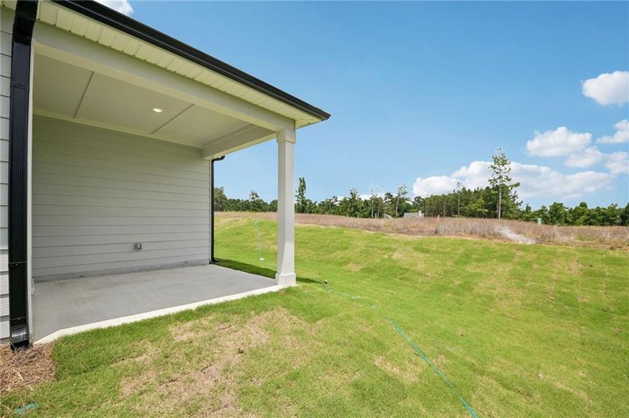 Exterior details and patio area of a home in Northwoods at Mirror Lake, Villa Rica (Image 28).