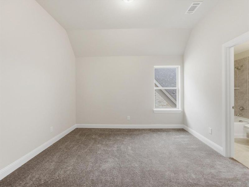 Carpeted room featuring a single window, white baseboards, and neutral wall paint