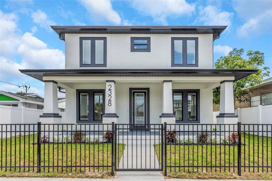 Front exterior of a new home in , Tampa, FL, highlighting curb appeal (Image 15).