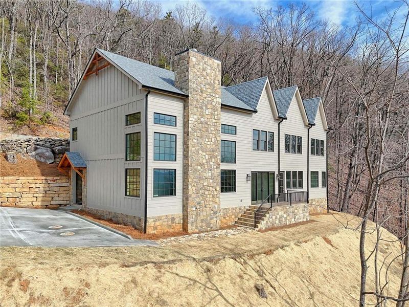 Front exterior of a new home in , Clayton, GA, highlighting curb appeal (Image 27).