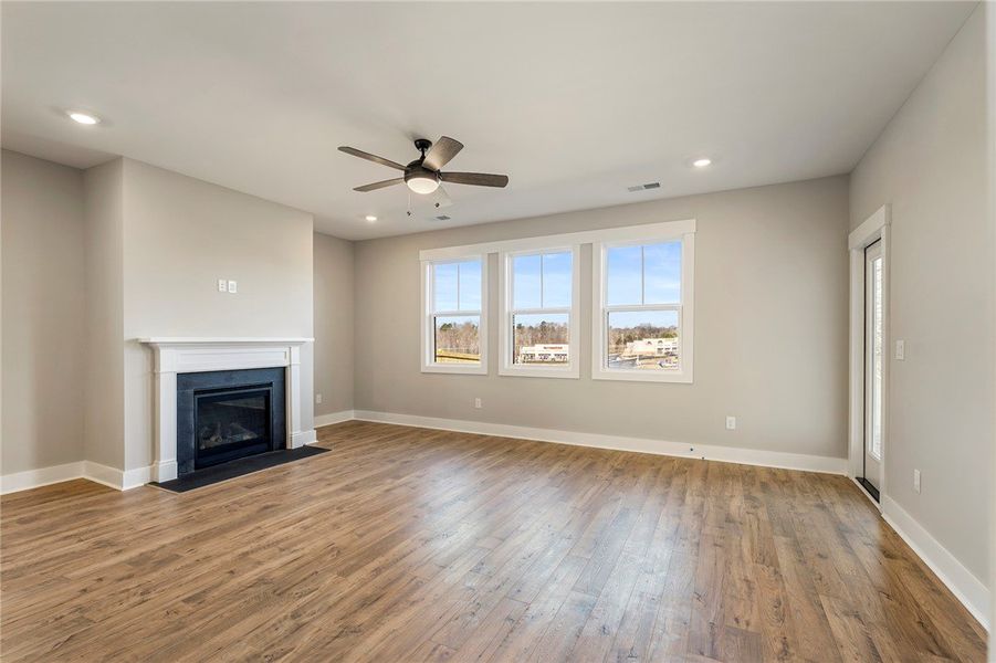 A welcoming living area featuring a cozy fireplace A welcoming living area featuring a cozy fireplace