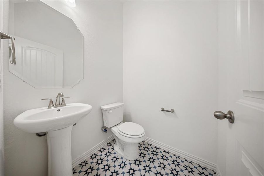 Bathroom with toilet and baseboards Bathroom with toilet and baseboards