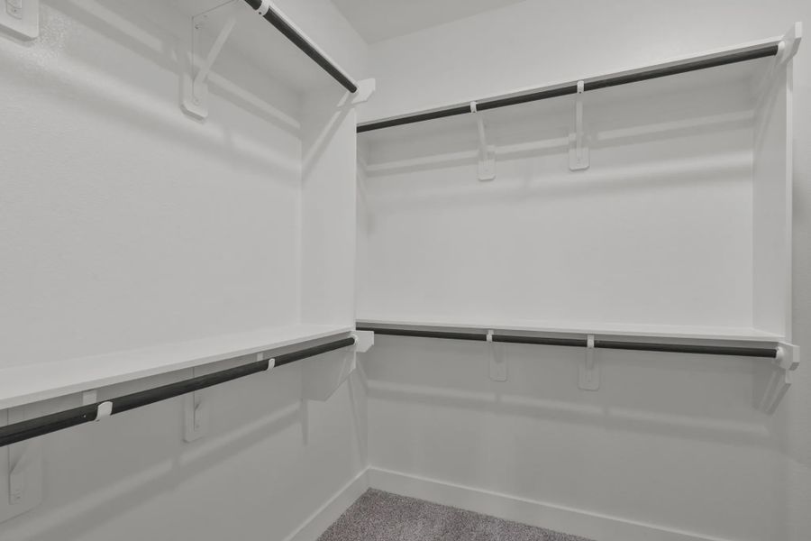 Representative unfurnished interior of a home built from the Carriagehouse by Chesmar Homes in Meridiana Townhomes, Iowa Colony (Image 96).