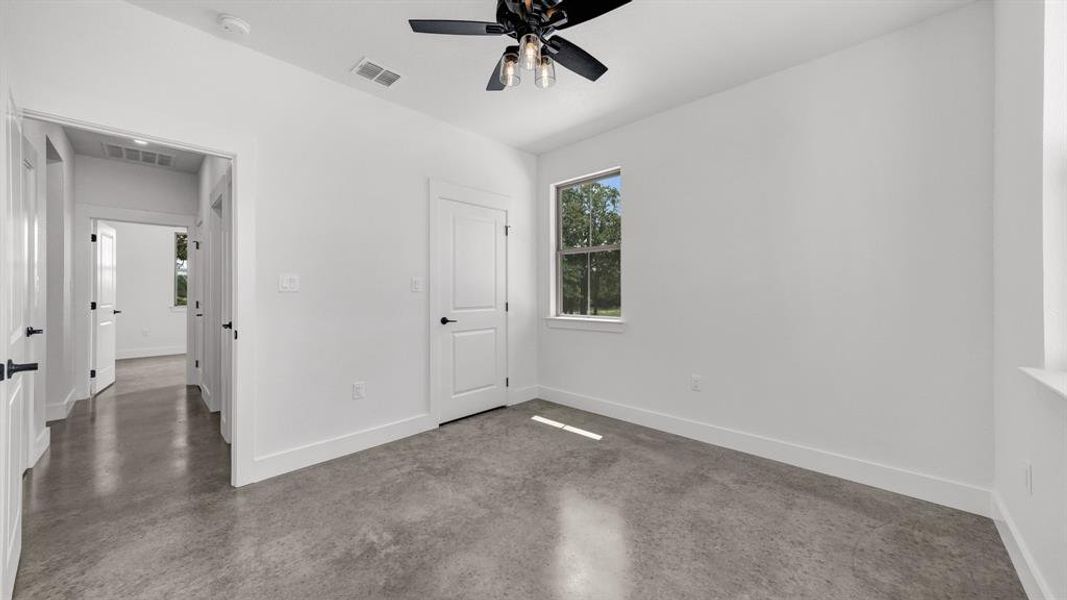 Sizable bedroom with stained concrete!