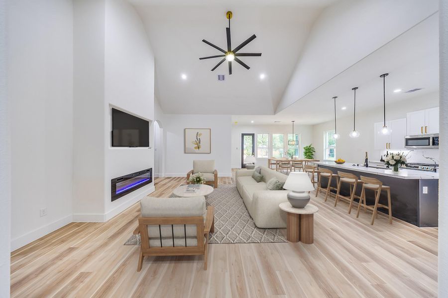 Warm, wood-like flooring throughout the home adds cozy elegance, durability, and a welcoming touch to every area of the home.