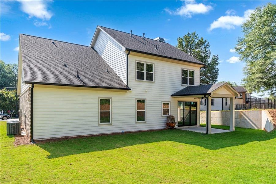 Front exterior of a new home in , Lawrenceville, GA, highlighting curb appeal (Image 26). Front exterior of a new home in , Lawrenceville, GA, highlighting curb appeal (Image 26).