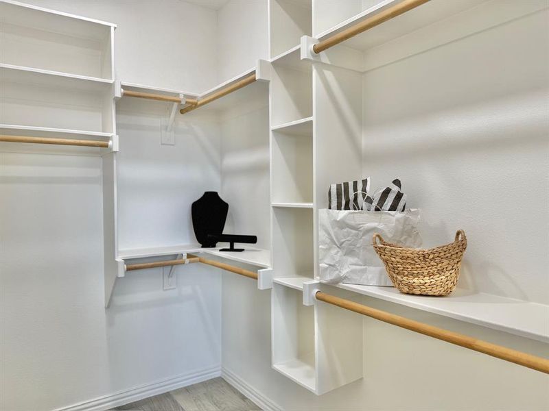 Walk in closet featuring light hardwood / wood-style flooring