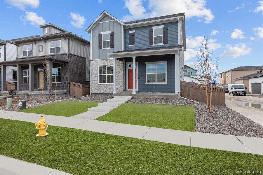 Front exterior of a new home in , Aurora, CO, highlighting curb appeal (Image 21).