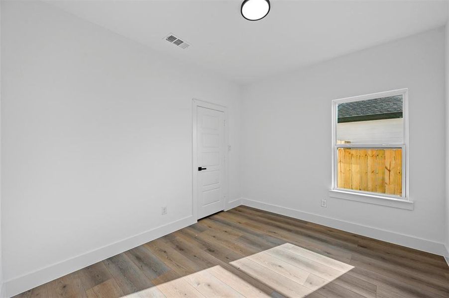 Empty room featuring hardwood / wood-style floors