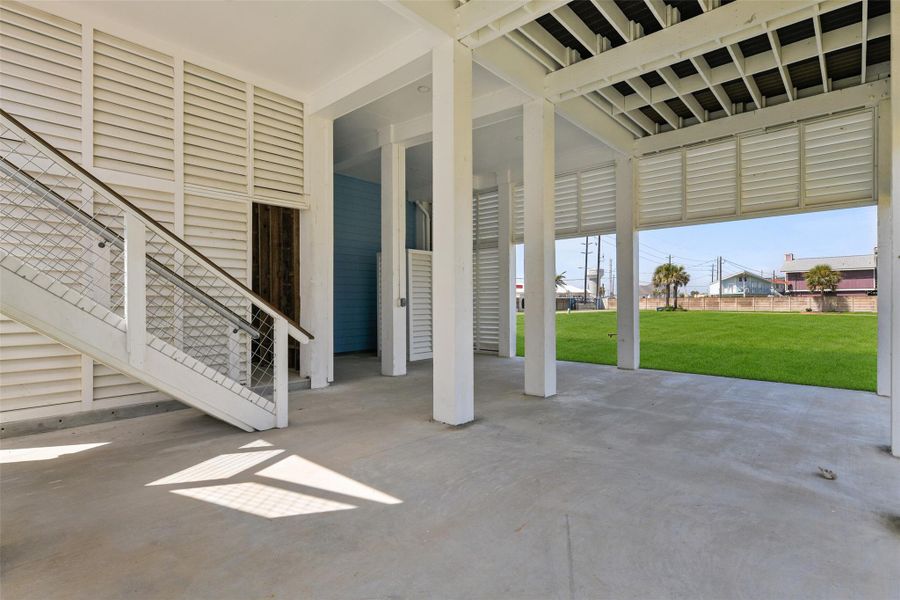 Experience the ultimate relaxation and entertainment in this open-air lower level, perfect for enjoying tranquil naps, feeling the refreshing coastal breeze, and hosting unforgettable barbecues. Experience the ultimate relaxation and entertainment in this open-air lower level, perfect for enjoying tranquil naps, feeling the refreshing coastal breeze, and hosting unforgettable barbecues.