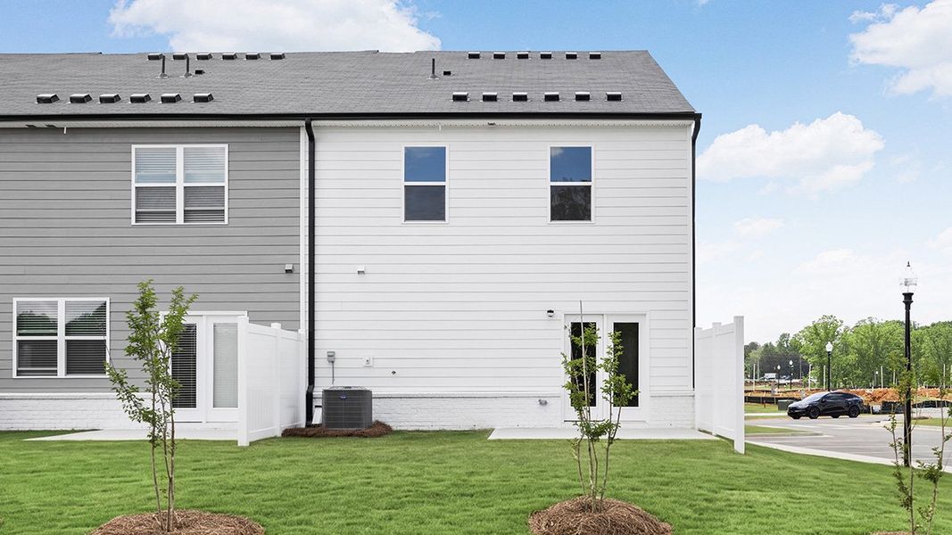 Exterior details and patio area of a home in Independence Villas and Townhomes, Loganville (Image 3).