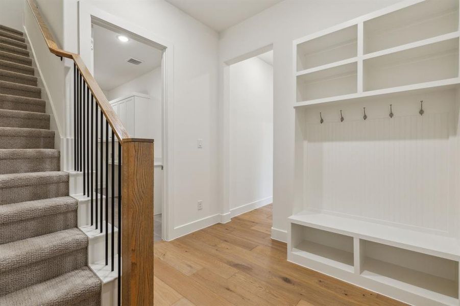 Mudroom with hardwood / wood-style flooring