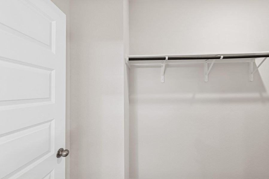 The Cardinal II- Primary Walk-In Closet. Photos of home shown are for illustration only; actual features, colors, and upgrades may vary. The Cardinal II- Primary Walk-In Closet. Photos of home shown are for illustration only; actual features, colors, and upgrades may vary.